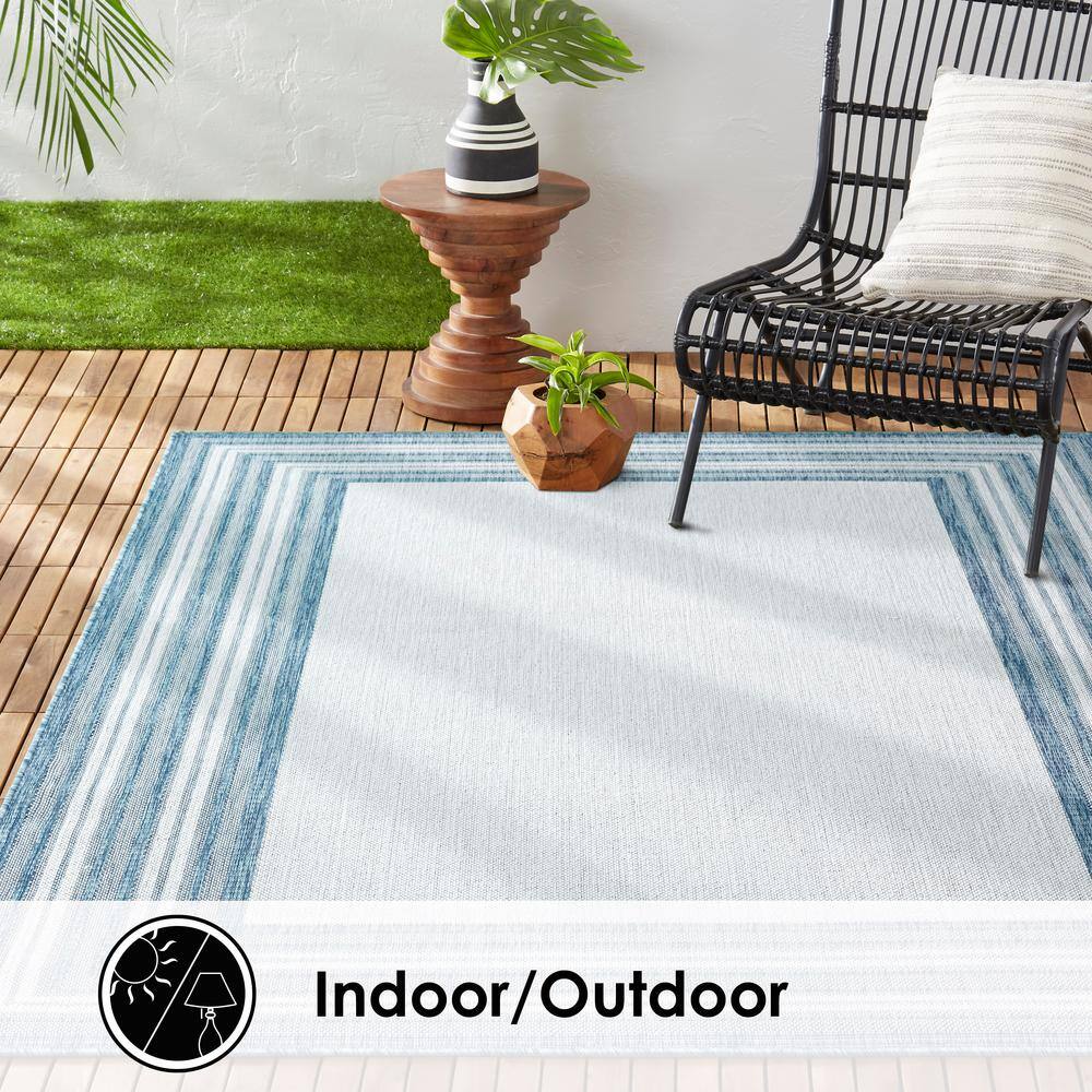 Blue and Ivory Striped Synthetic Indoor/Outdoor Area Rug