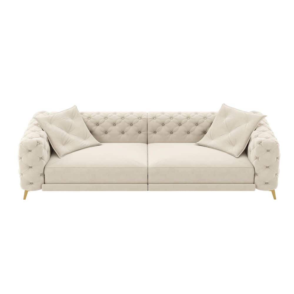 Full view of the beige/white velvet sofa with ottoman.