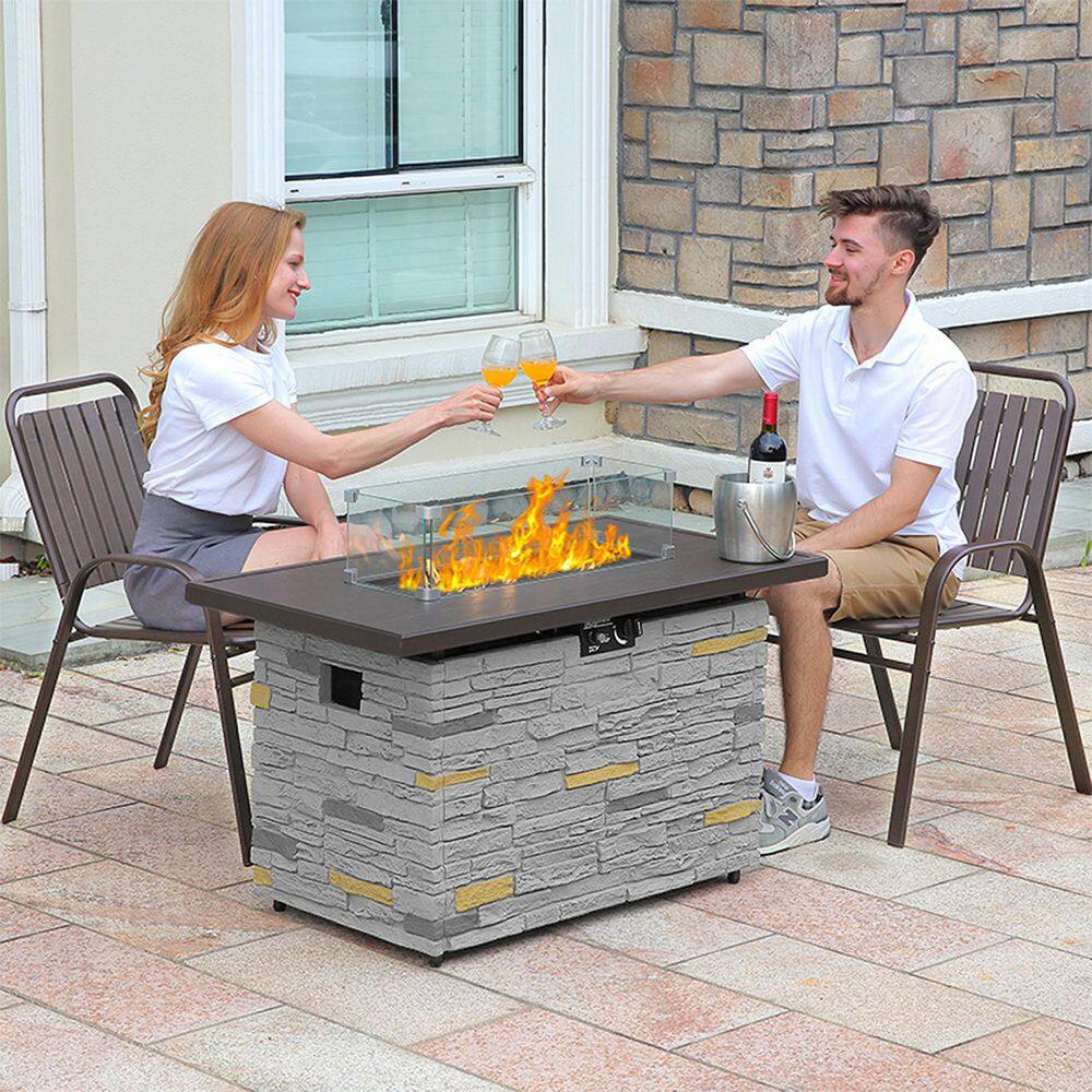 43" Gray Stone Propane Fire Pit Table with Glass Wind Guard