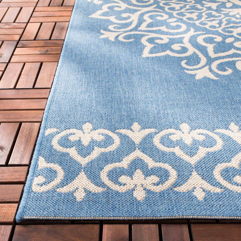 Cream and Blue Medallion Synthetic 8' x 10' Reversible Area Rug