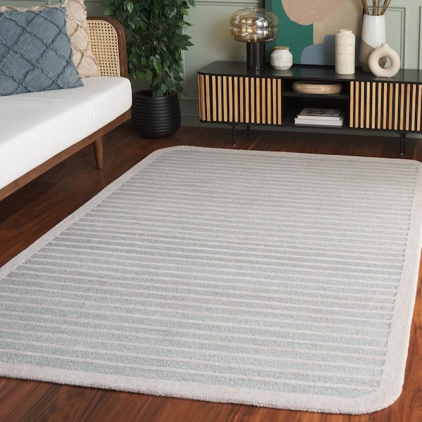 Ebony 8 ft. x 10 ft. Light Blue/Ivory High-Low Striped Border Area Rug