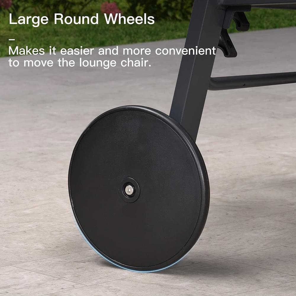 Close-up of a large black wheel on a chaise lounge.