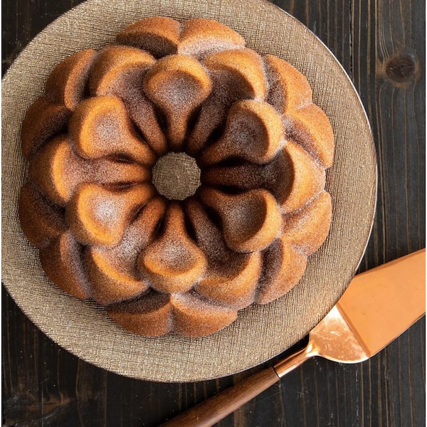 https://images.thdstatic.com/productImages/7552e953-e729-42f9-a0d6-1c2d274a8349/svn/brown-nordic-ware-fluted-tube-cake-pans-93848m-fa_600.jpg