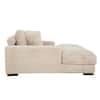 Side view of a taupe ribbed faux-fur oversized chaise lounge.