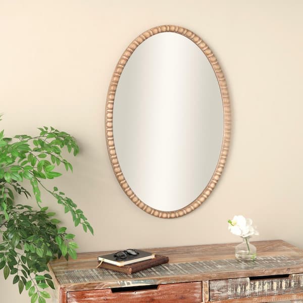 Litton Lane 37 in. x 25 in. Oval Framed Brown Wall Mirror with Beaded Inspired Frame