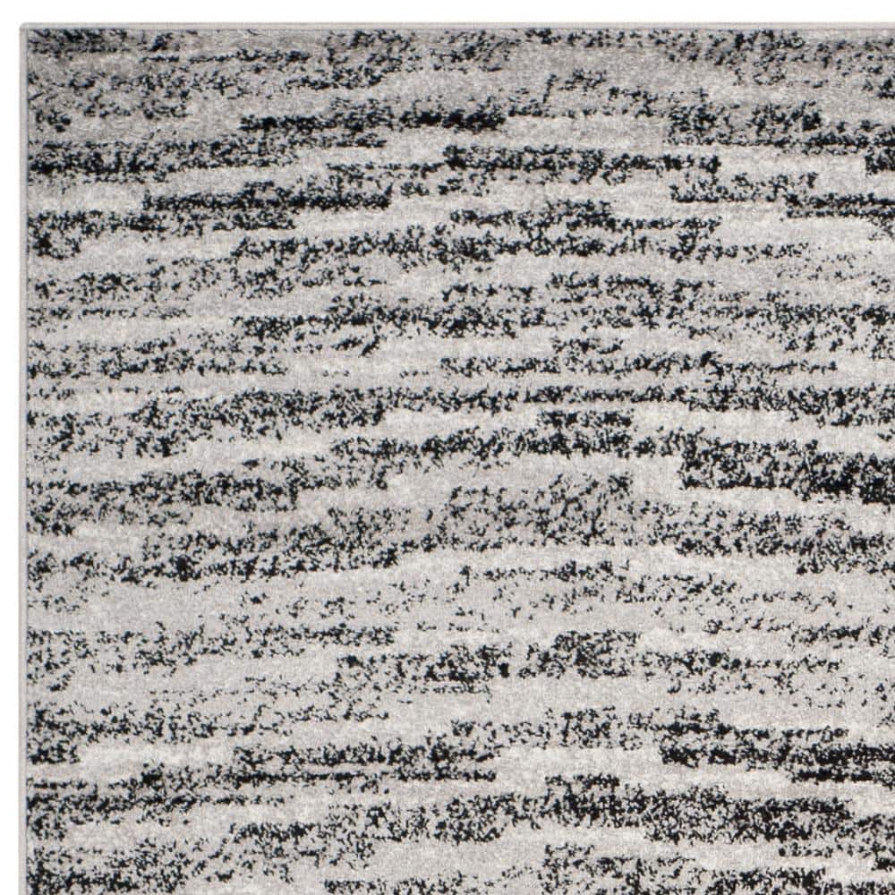 Reversible Black Stripe Synthetic 8' x 10' Rectangular Rug