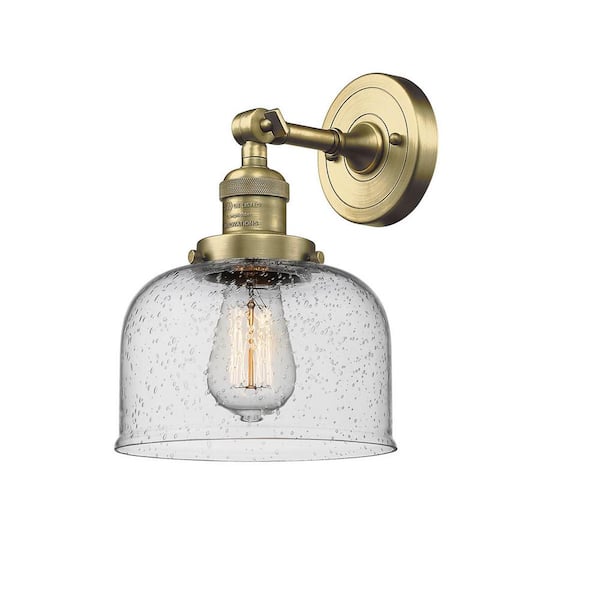 Bell 1-Light Seedy, Antique Brass Wall Sconce with Clear Glass Shade