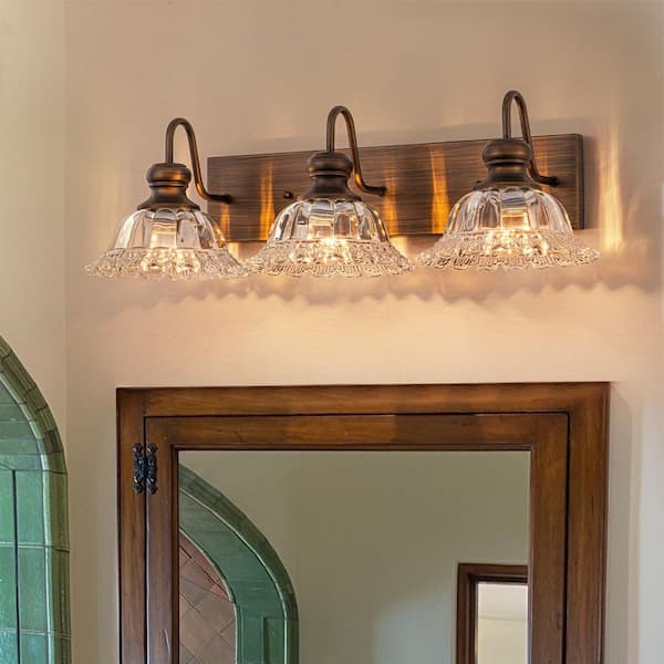 25 in. 3-Light Oil Rubbed Bronze Vintage Bathroom Vanity Light with Clear Flower Glass Shades