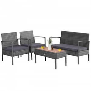 4-Piece Rattan Patio Conversation Furniture Set with Acacia Wood Tabletop and Gray Cushions