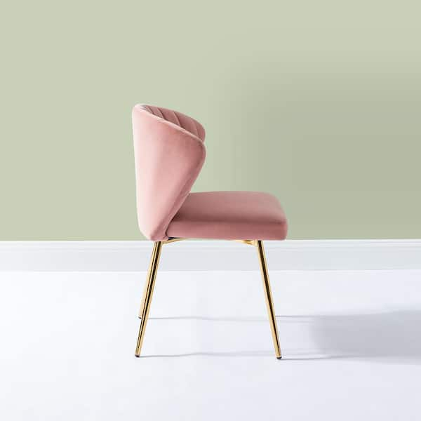 pink chair with white legs