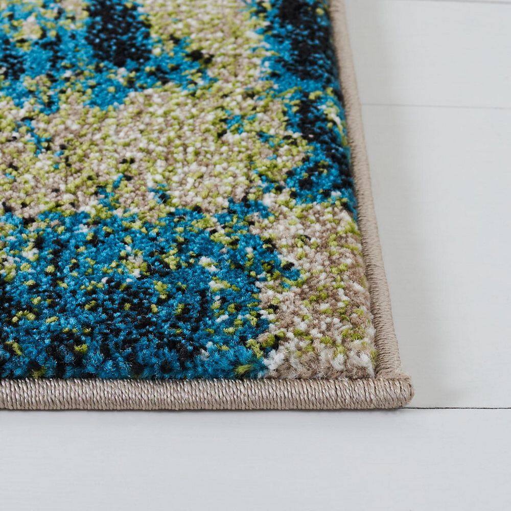 Navy and Green Abstract 4' x 6' Synthetic Area Rug