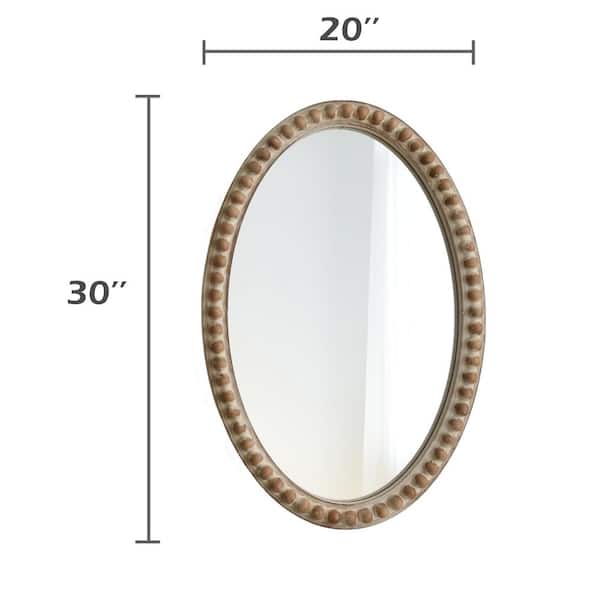 Cylindrical wood beads hand-sewn in a unique design over a metal frame.  Mirror comes with metal