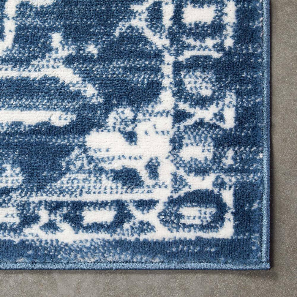 Light Blue Floral Synthetic Reversible 5' x 7' Rug