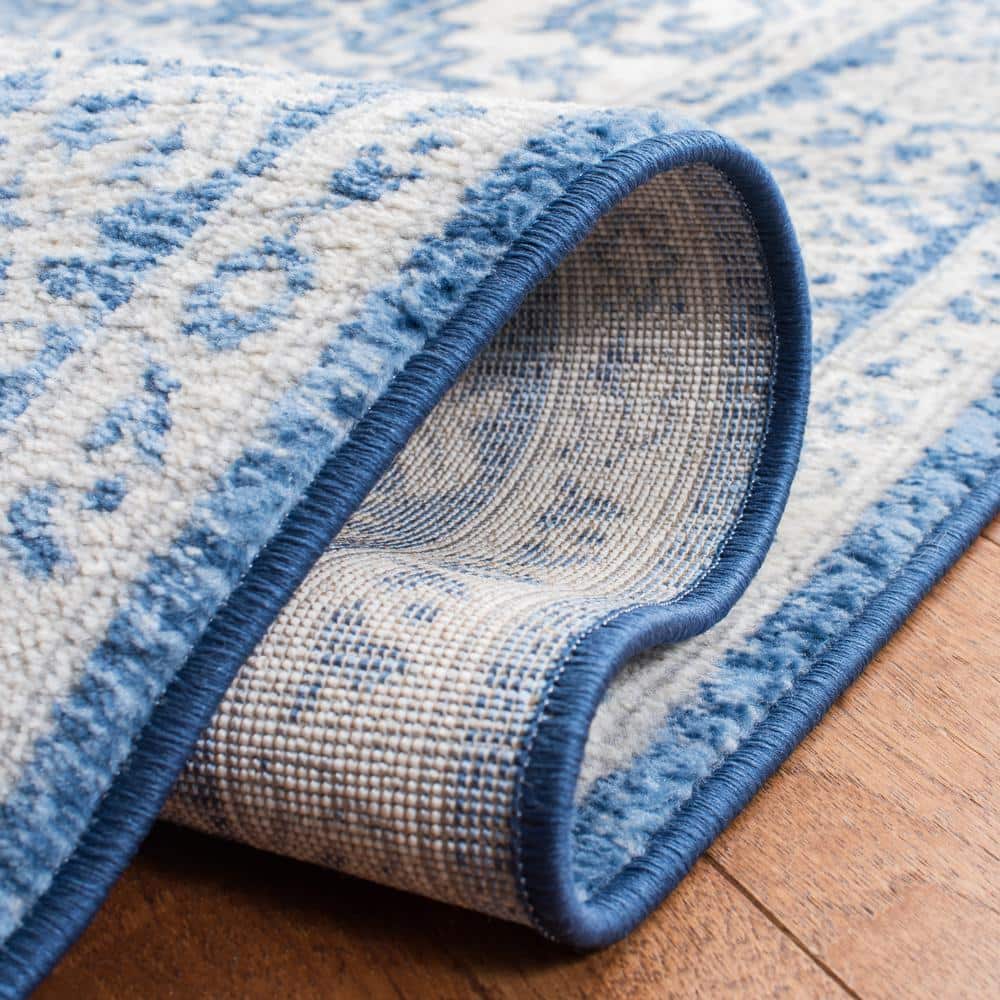 Ivory and Navy 8' x 10' Synthetic Washable Reversible Area Rug