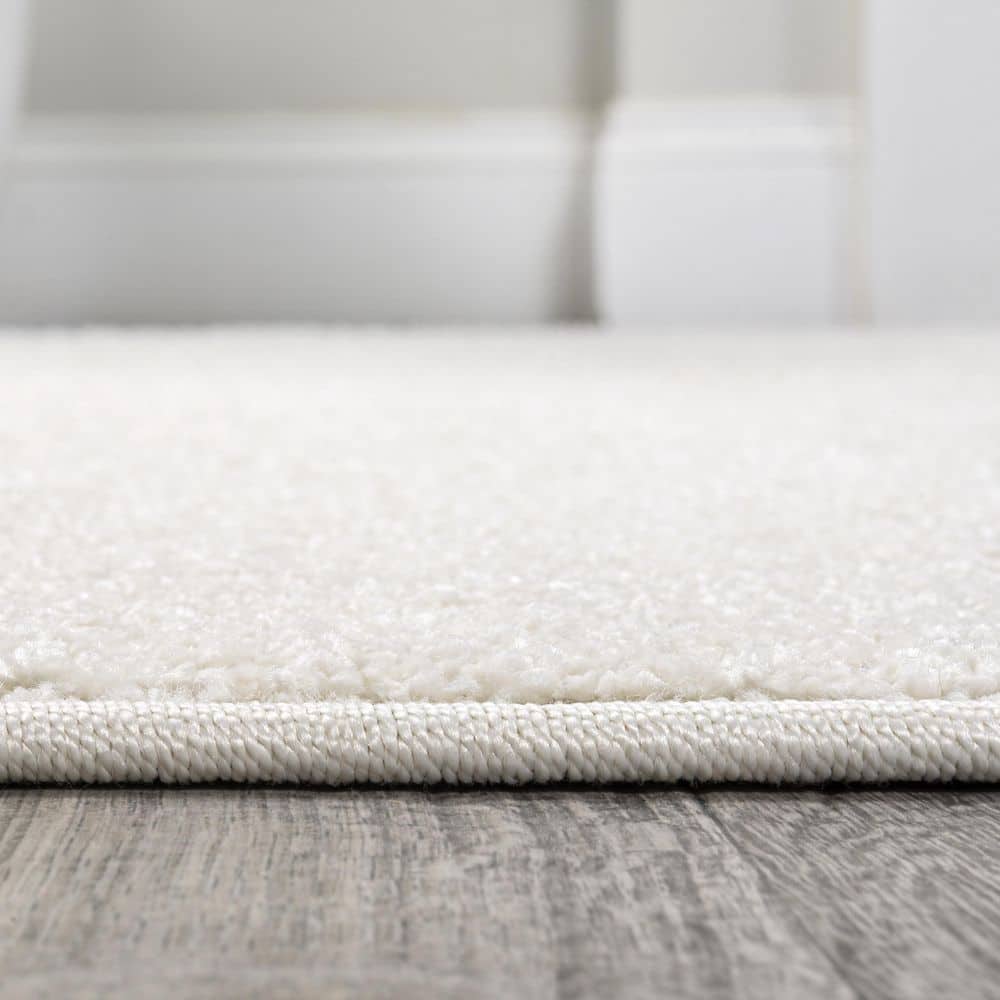 Cream Oval Low-Pile Synthetic Indoor Area Rug