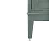 Close-up of the tapered leg and adjustable leveler of a smoke green vanity.