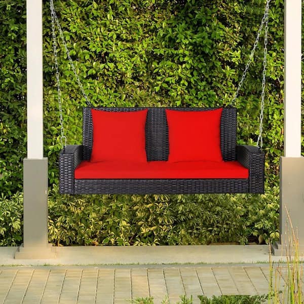 Zeus & Ruta 2-Person Red Metal Patio Rattan Porch Swing with Cushions