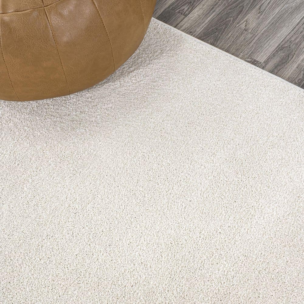 Cream Oval Low-Pile Synthetic Indoor Area Rug