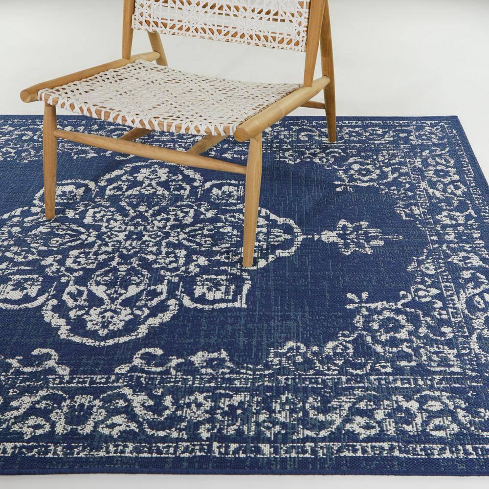 Blue and White Synthetic Oriental 8' x 10' Area Rug