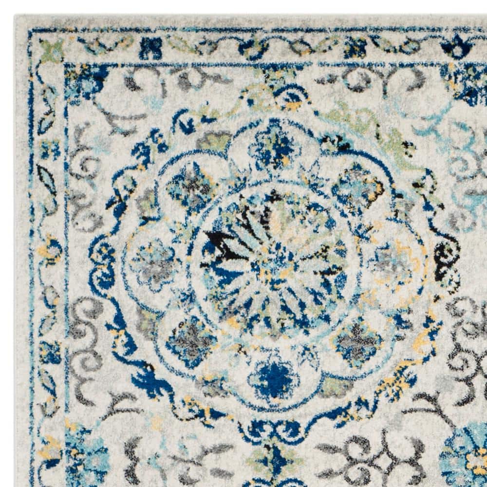 Ivory and Blue Floral Motif Synthetic Area Rug