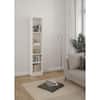 White bookcase in a modern living room with decor.