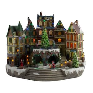 17 in. LED Lighted European Village Winter Christmas Scene with Twirling Tree