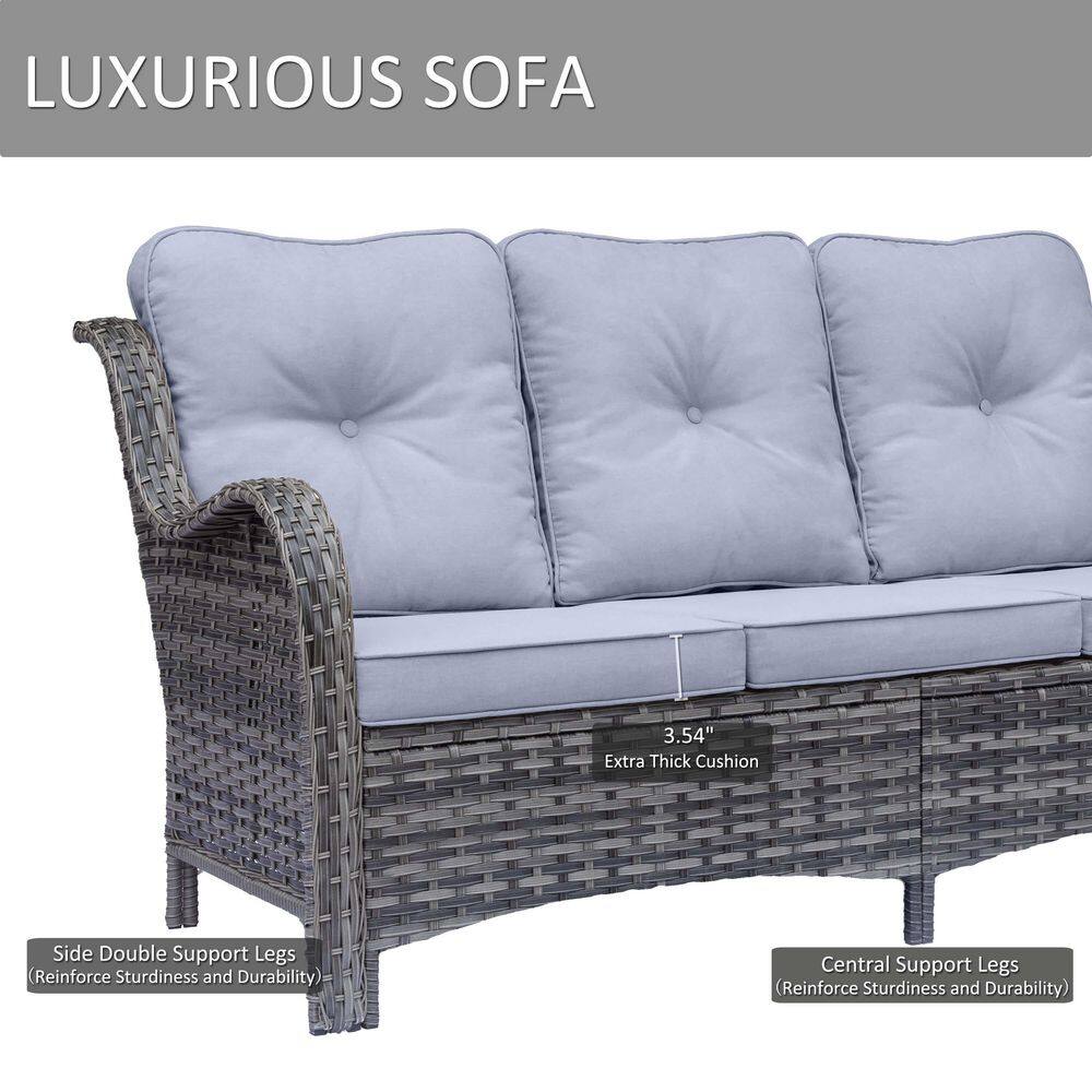 Close-up of a gray wicker sofa with a thick gray cushion.