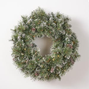 24 in. Battery Operated Pre-Lit LED Artificial Christmas Wreath with Flocked Snow, Glitter Branches, and Pinecones