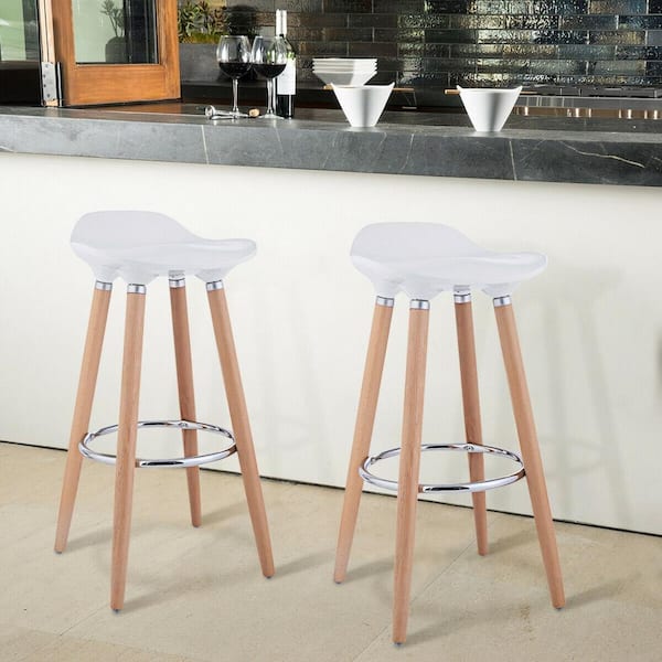 white bar stools with wooden legs