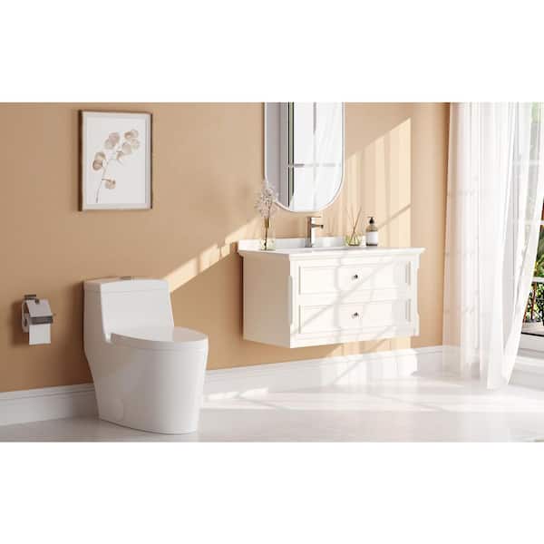 Prism One Piece 1.1/1.6 GPF Dual Flush Elongated Toilet in White 10 in. Rough In, Soft Closed Seat Included