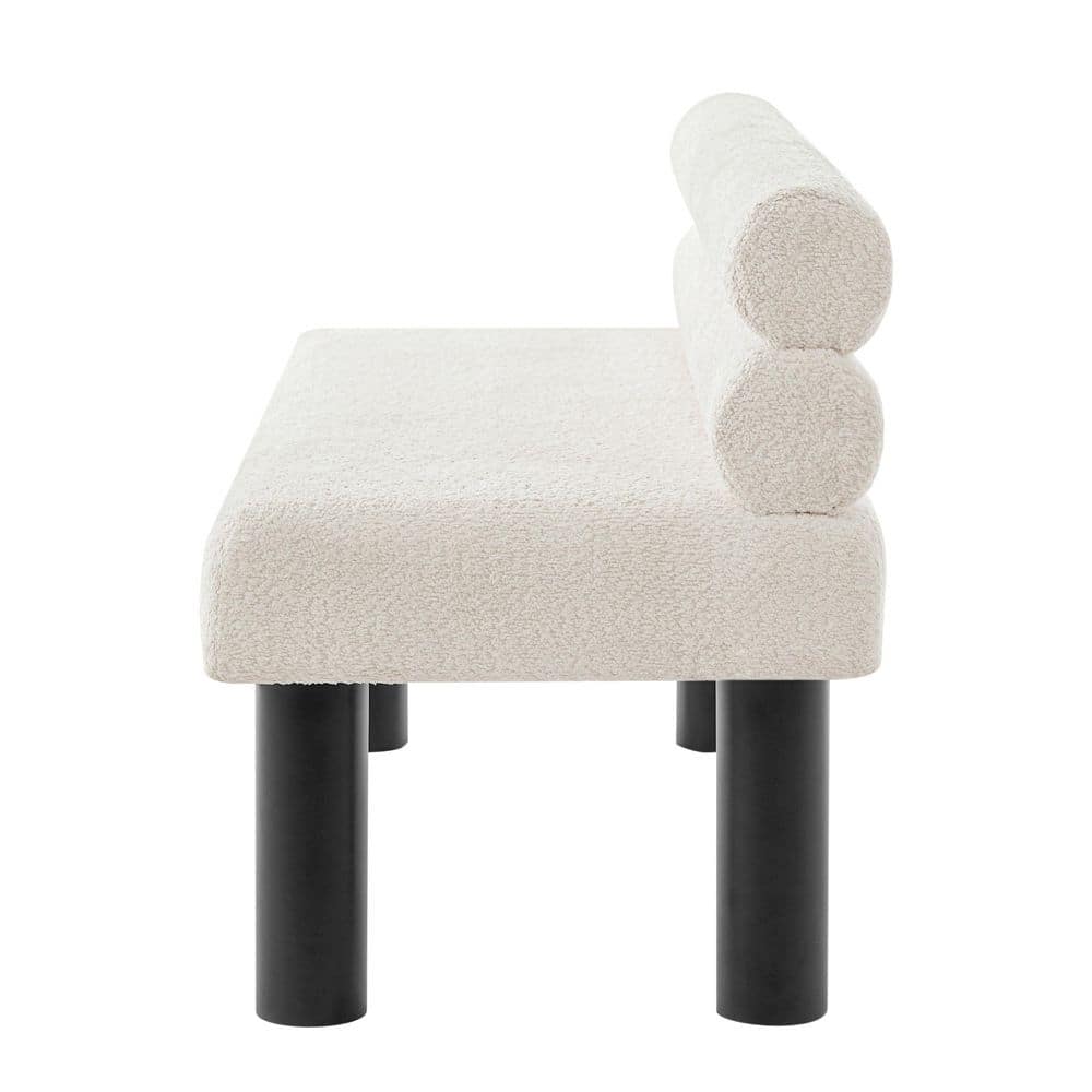 Side view of a beige boucle upholstered bench with black legs.