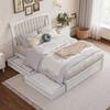 White solid wood platform bed with two open storage drawers.