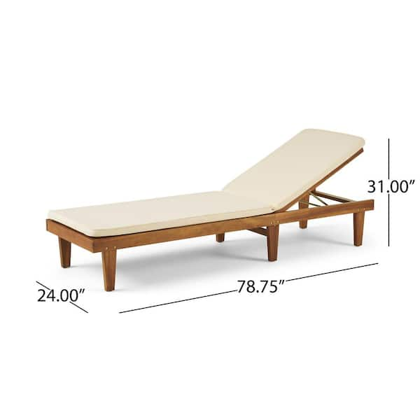 wooden sun lounger with cream cushion