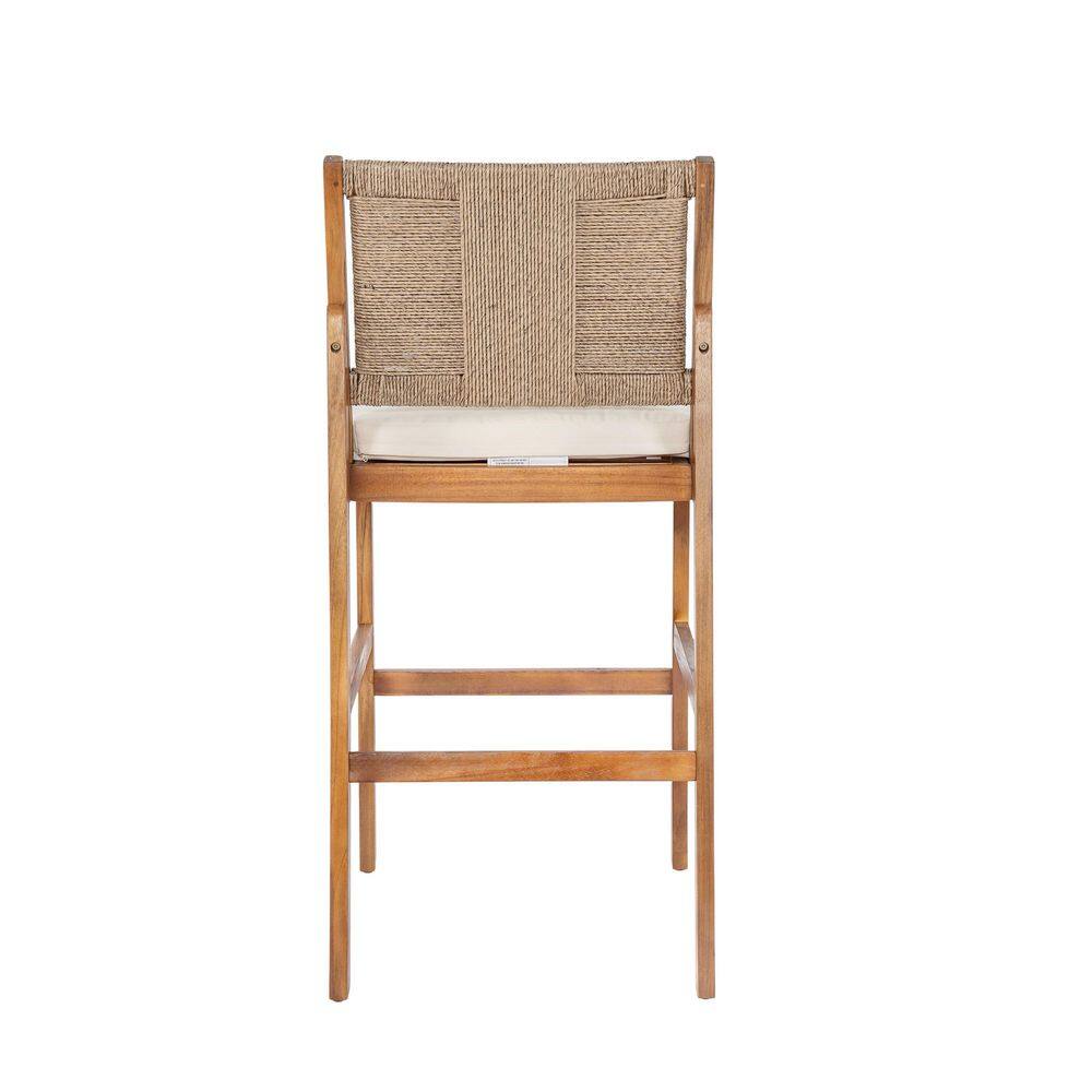 Rear view of a high-back bar stool showing the light brown wicker backrest.