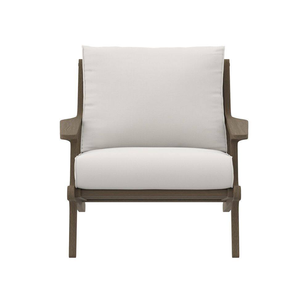 Front view of a weathered gray teak wood armchair with white cushions.