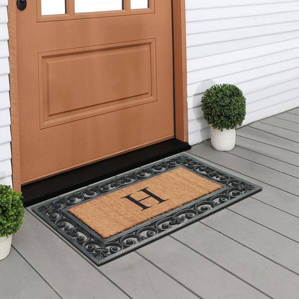 https://images.thdstatic.com/productImages/78b2f16d-87d0-402b-883d-ef944ff0aca4/svn/black-a1-home-collections-door-mats-200085bl-18x30h-44_600.jpg