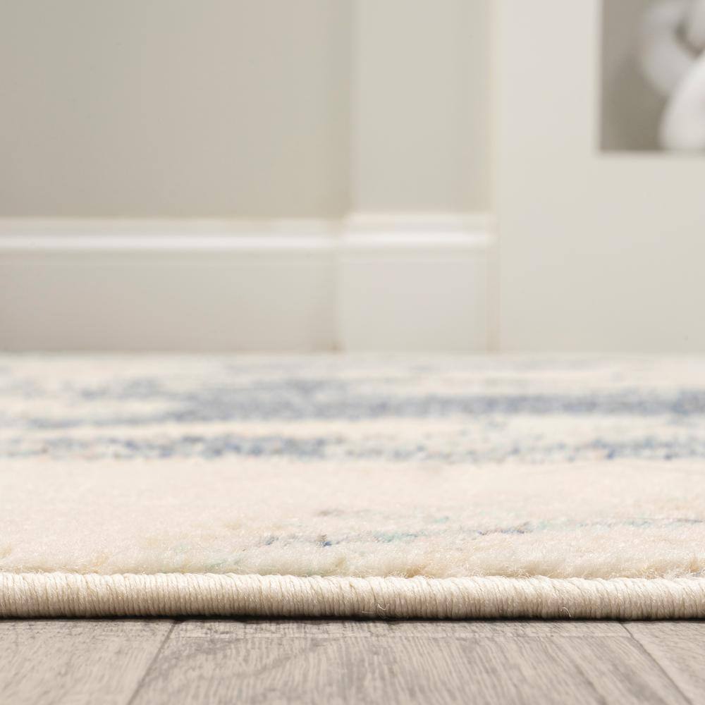 Blue and Cream Abstract 8' x 10' Synthetic Area Rug