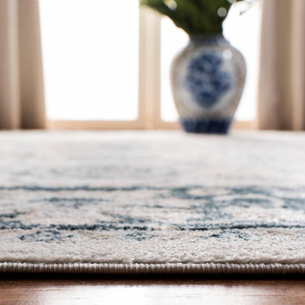 Isabella Cream and Navy 4' x 6' Synthetic Oriental Area Rug