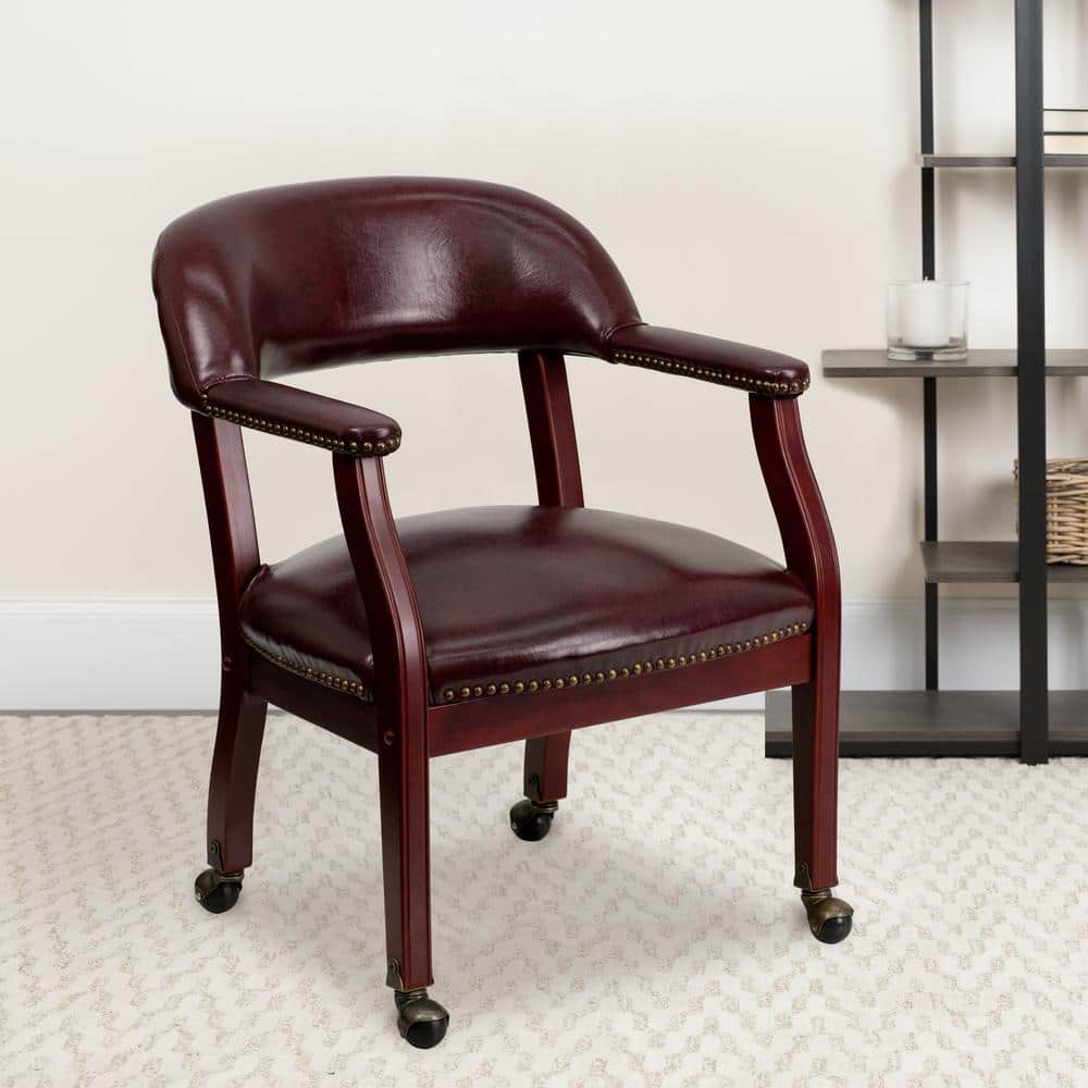 Elegant Oxblood Vinyl Conference Chair with Brass Nail Trim