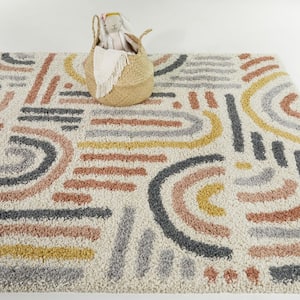 Marie Cream 5 ft. 3 in. x 7 ft. Abstract Area Rug