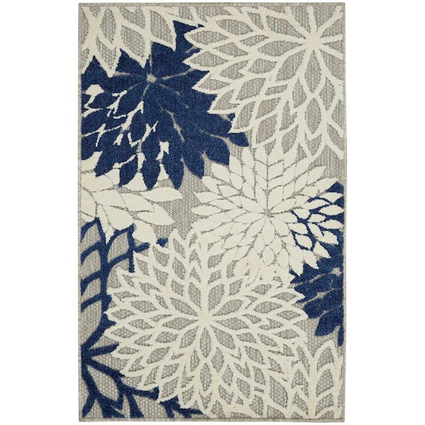 https://images.thdstatic.com/productImages/799133df-5b68-4555-98e4-ac2b40f81b5f/svn/ivory-navy-nourison-outdoor-rugs-778772-64_600.jpg