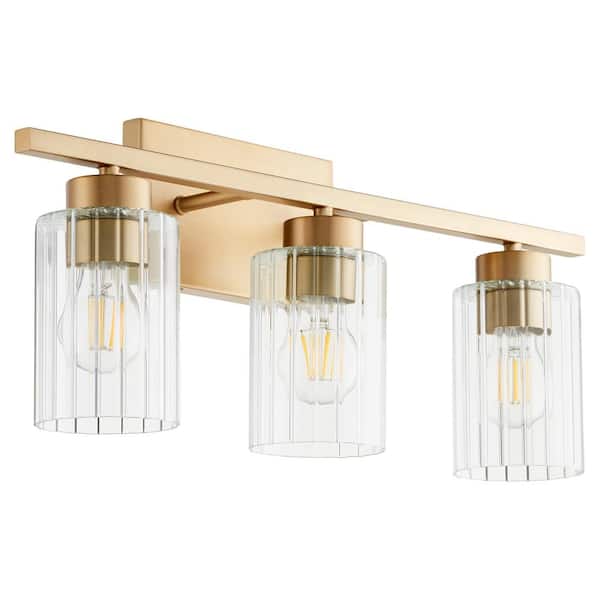 Quorum International Ladin 3-Light Aged Brass with Clear Fluted Glass Vanity