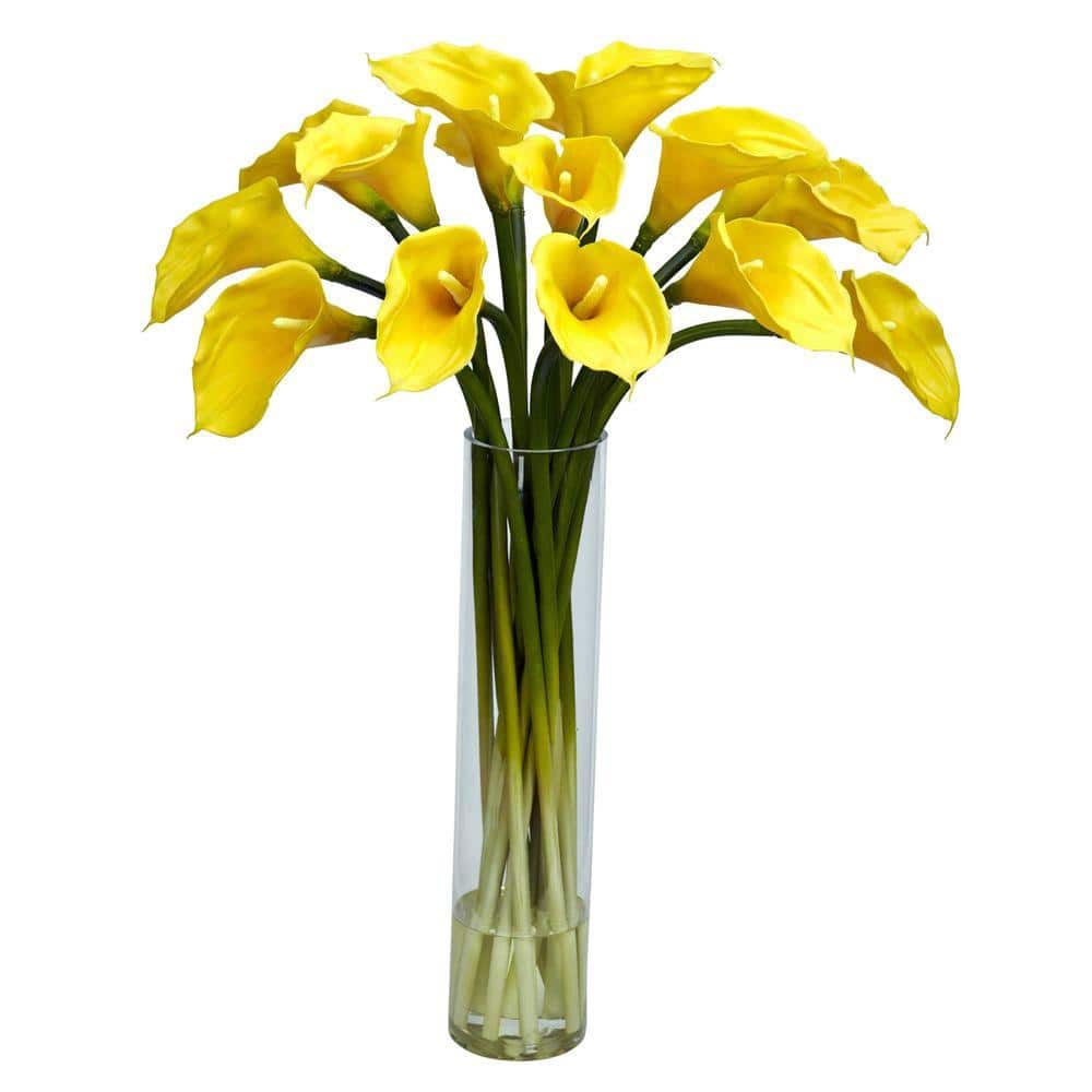 Nearly Natural 27 in. Artificial H Yellow Calla Lilly with Cylinder Silk Flower Arrangement Ooooh nice. That's what we thought when we stepped back after creating this large Calla Lilly, and it's what your guests will say when they gaze upon it. With several fresh-looking stalks rising in a tall cylinder vase (complete w/ faux water) giving way to the gaping white blooms above, this is an arrangement that permeates a peaceful, tranquil feeling. And because it never needs water and care, those feelings will last a lifetime.