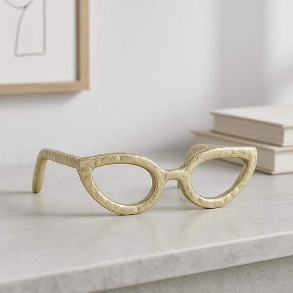 Liv & Skye Gold 7 in. x 3 in. Metal Abstract Cat Eye Glasses Sculpture