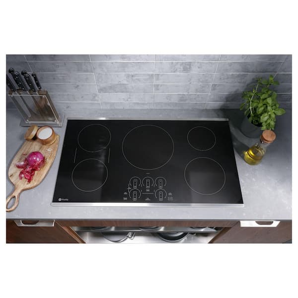 https://images.thdstatic.com/productImages/7a1d6376-ae35-450a-914e-1c2cddca61db/svn/stainless-steel-ge-profile-induction-cooktops-php9036stss-4f_600.jpg