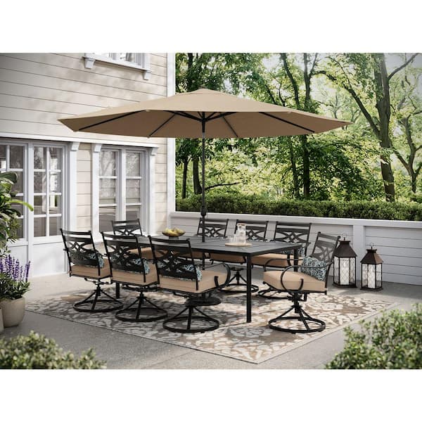 Hanover Montclair 9-Piece Steel Outdoor Dining Set with Tan Cushions, 8 Swivel Rockers, 42 in. x 84 in. Table and Umbrella