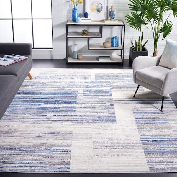 Shivan 9 ft. x 12 ft. Ivory/Blue Abstract Geometric Striped Area Rug
