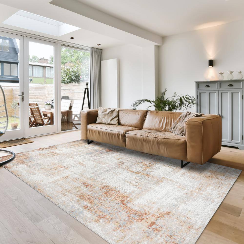 Ivory and Orange Abstract Polypropylene Indoor Area Rug