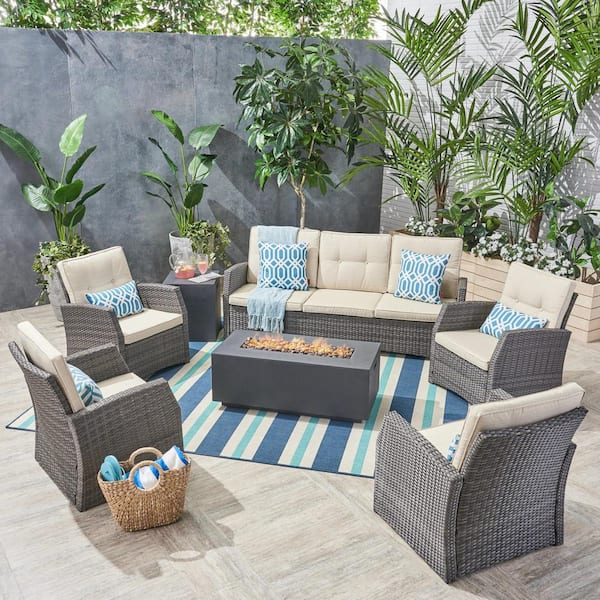 Noble House Sanger Gray 7-Piece Faux Rattan Patio Fire Pit Conversation Set with Beige Cushions