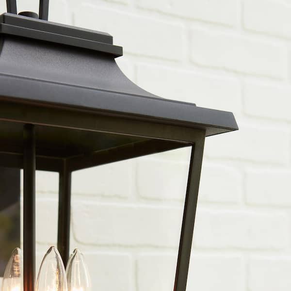 https://images.thdstatic.com/productImages/7a6a43e9-228b-4620-8f2f-9ce1436fb624/svn/textured-black-generation-lighting-outdoor-sconces-ol15403txb-1f_600.jpg